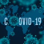world map and COVID-19 words with the molecules of the virus on it