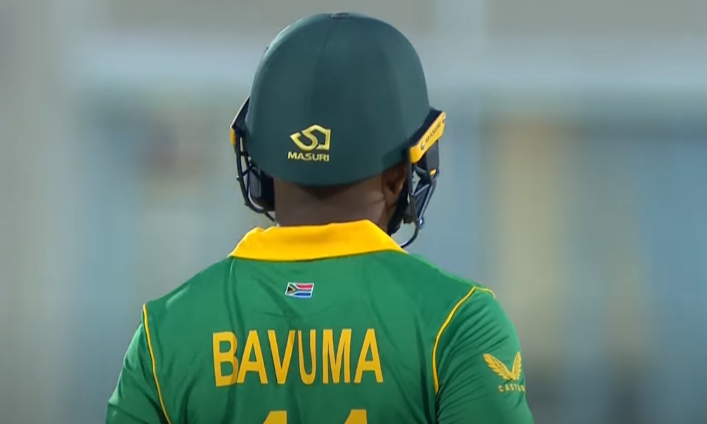 Bavuma's back with jersey name, wearing baseball helmet